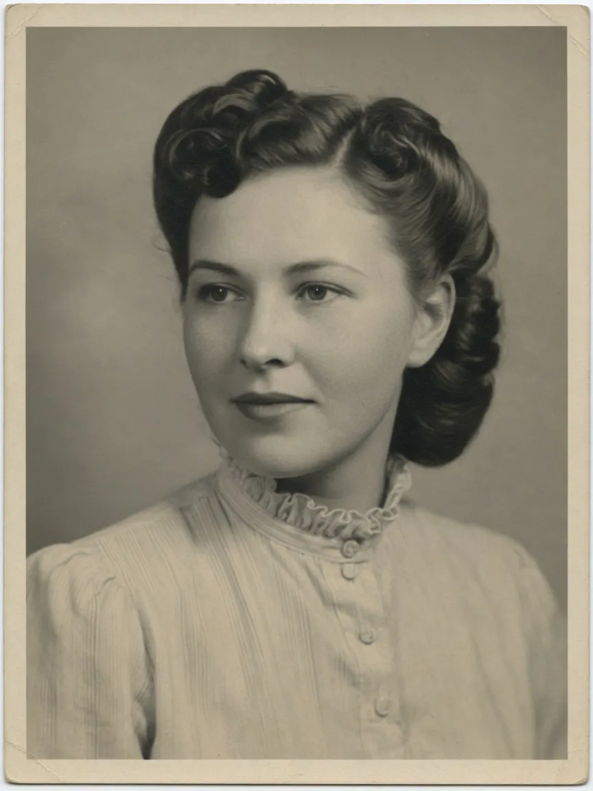 Repaired black-and-white studio portrait after AI restoration